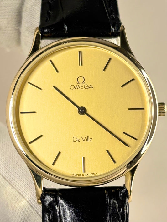 Close-up of Omega quartz movement dress watch, gold dial, vintage 1980s