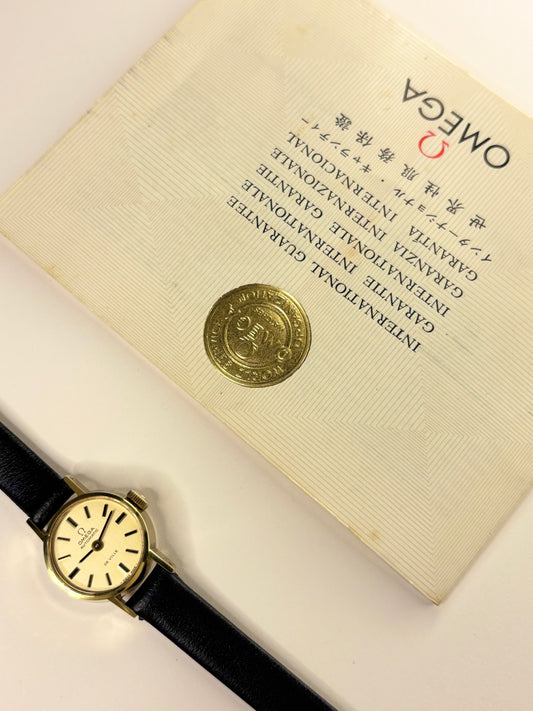 Vintage 1974 Omega ladies timekeeper ref. 551.0057 — slim 18mm gold-plated case with calibre 661 automatic mechanism and papers