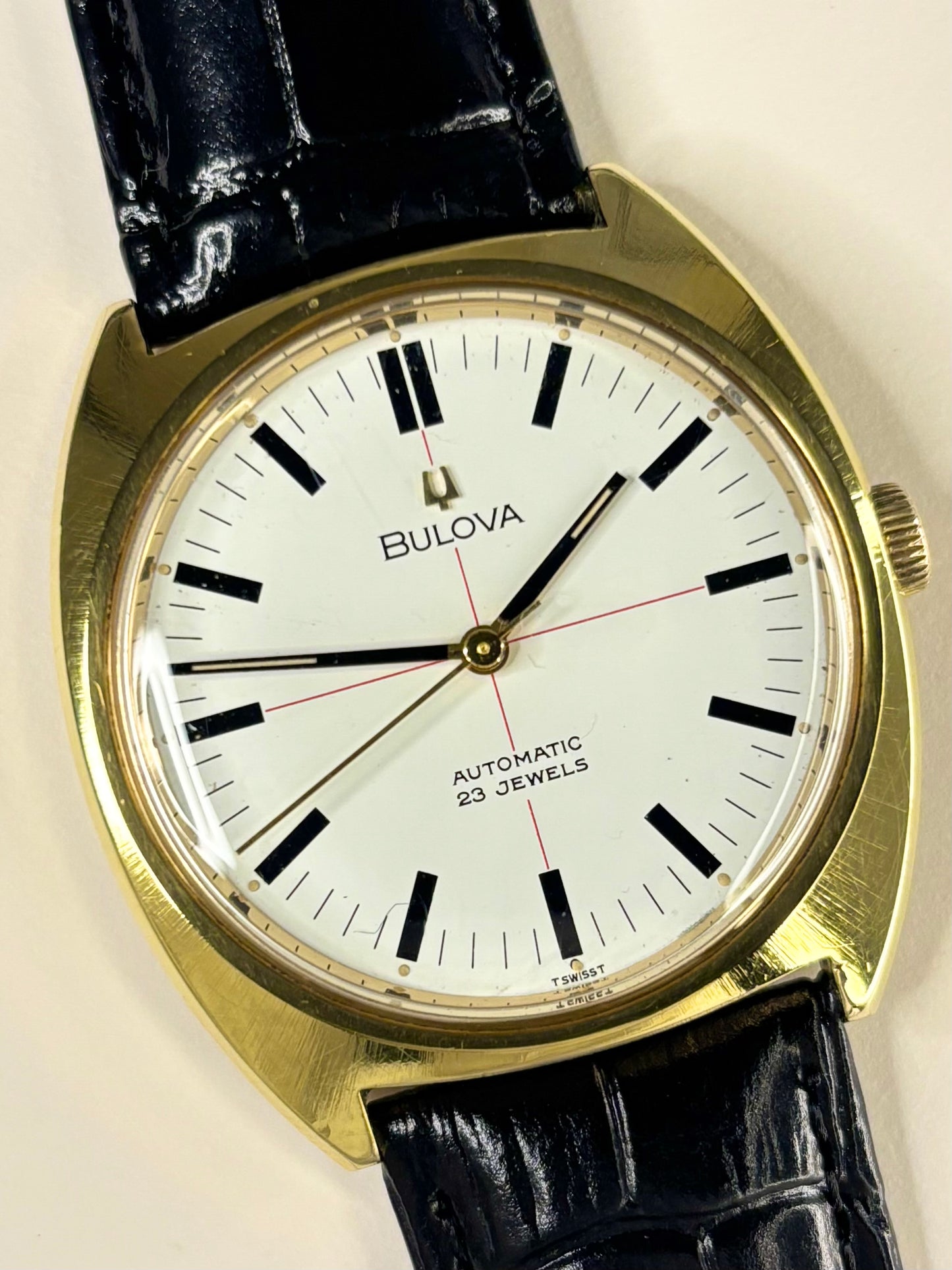 Close-up of Bulova 1970s men’s gold-plated dress watch white dial