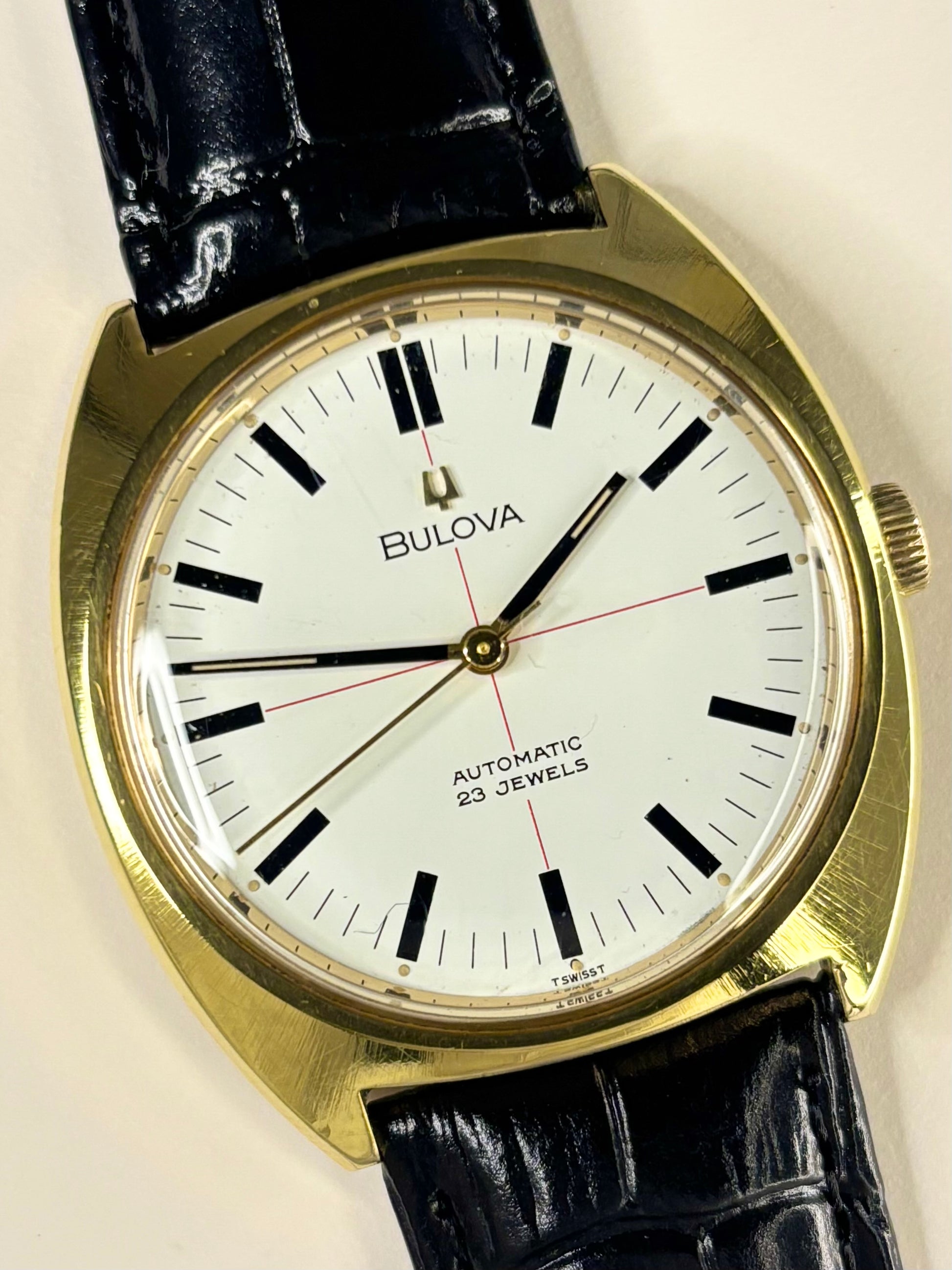 Close-up of Bulova 1970s men’s gold-plated dress watch white dial