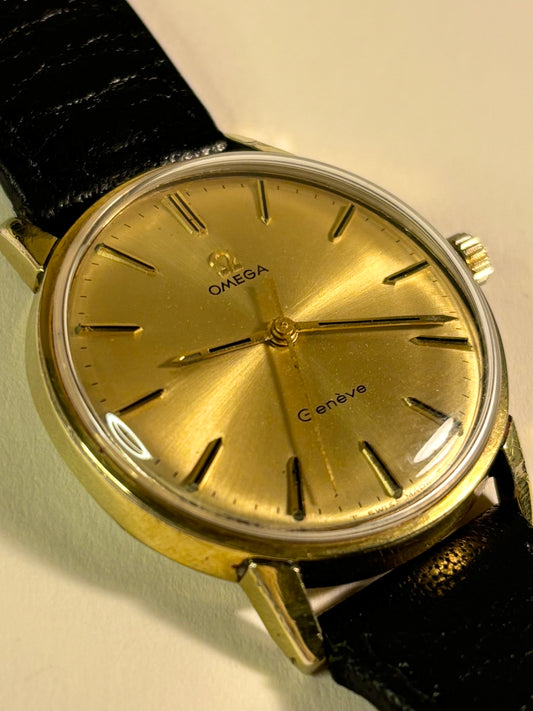 Vintage Omega Genève Ref. 601 men’s gold plated dress timekeeper showcasing elegant 1960s Swiss design