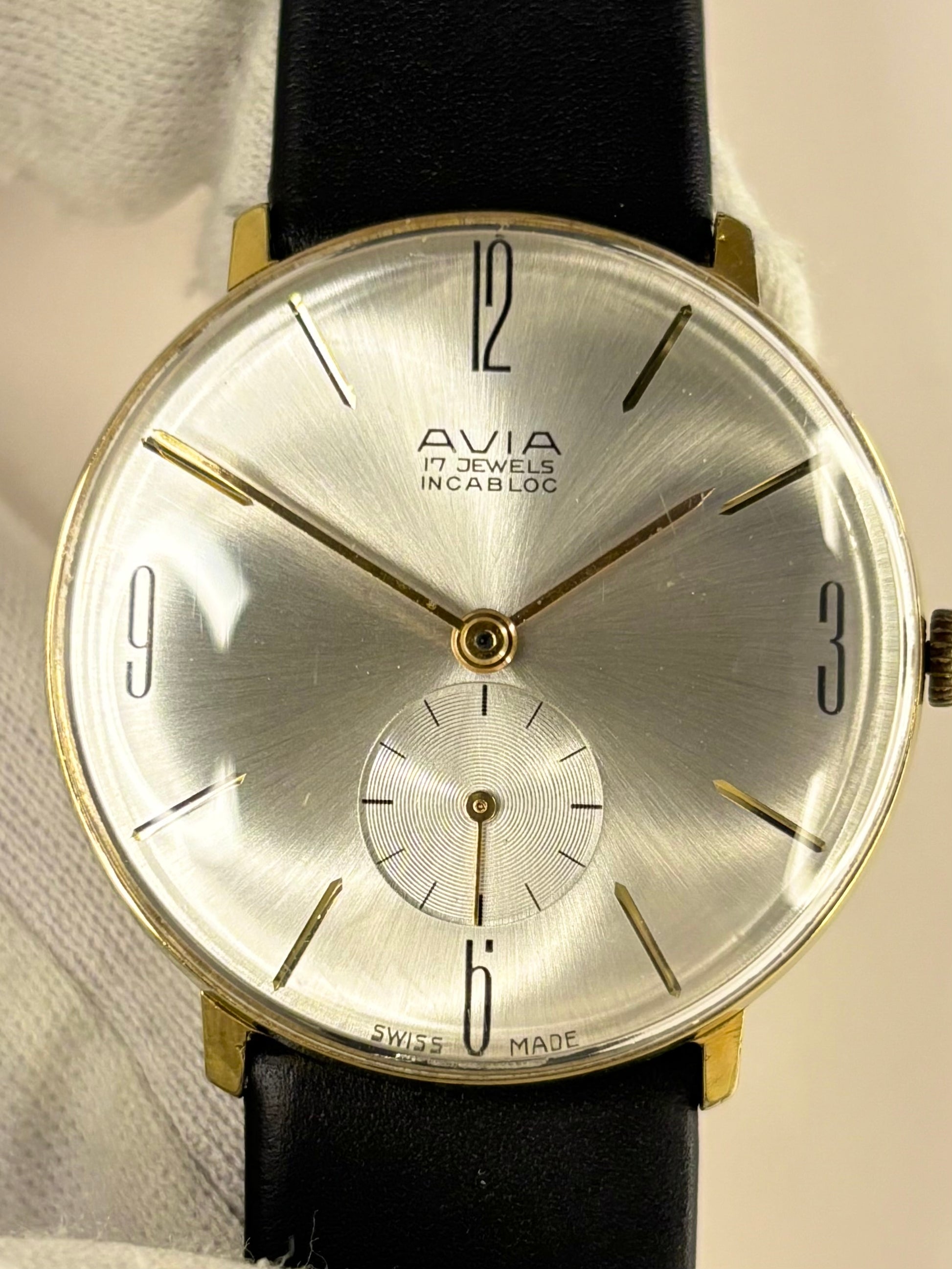 Close up of Avia 1960s white sunburst dial vintage men’s watch
