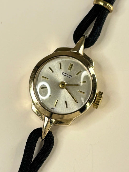 Vintage Tudor 1957 ladies 9ct gold timekeeper showcasing elegant mid-century Swiss design