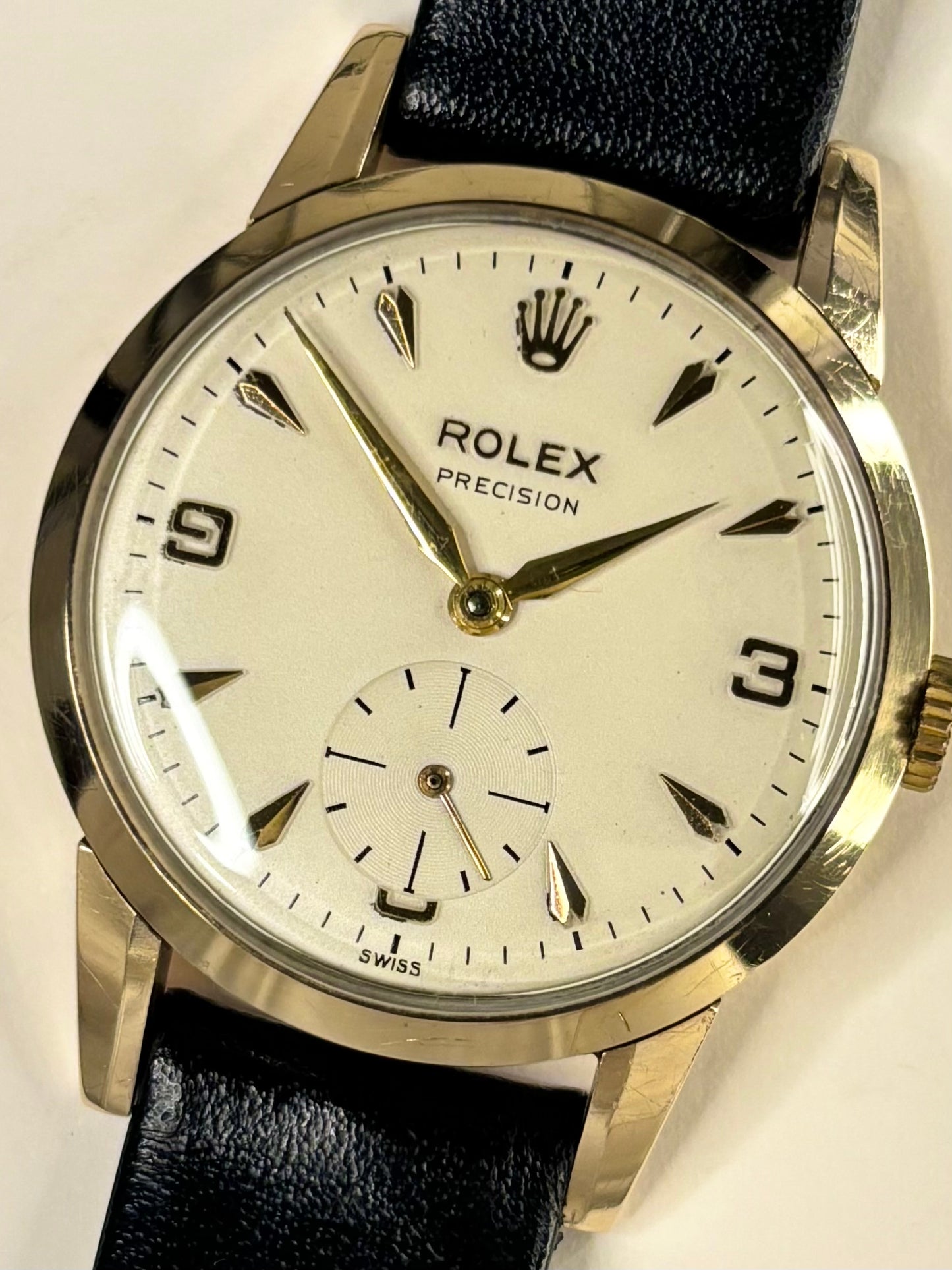 Close-up of Rolex Precision vintage dress watch with 9ct solid gold case and original dial, ref. 1200