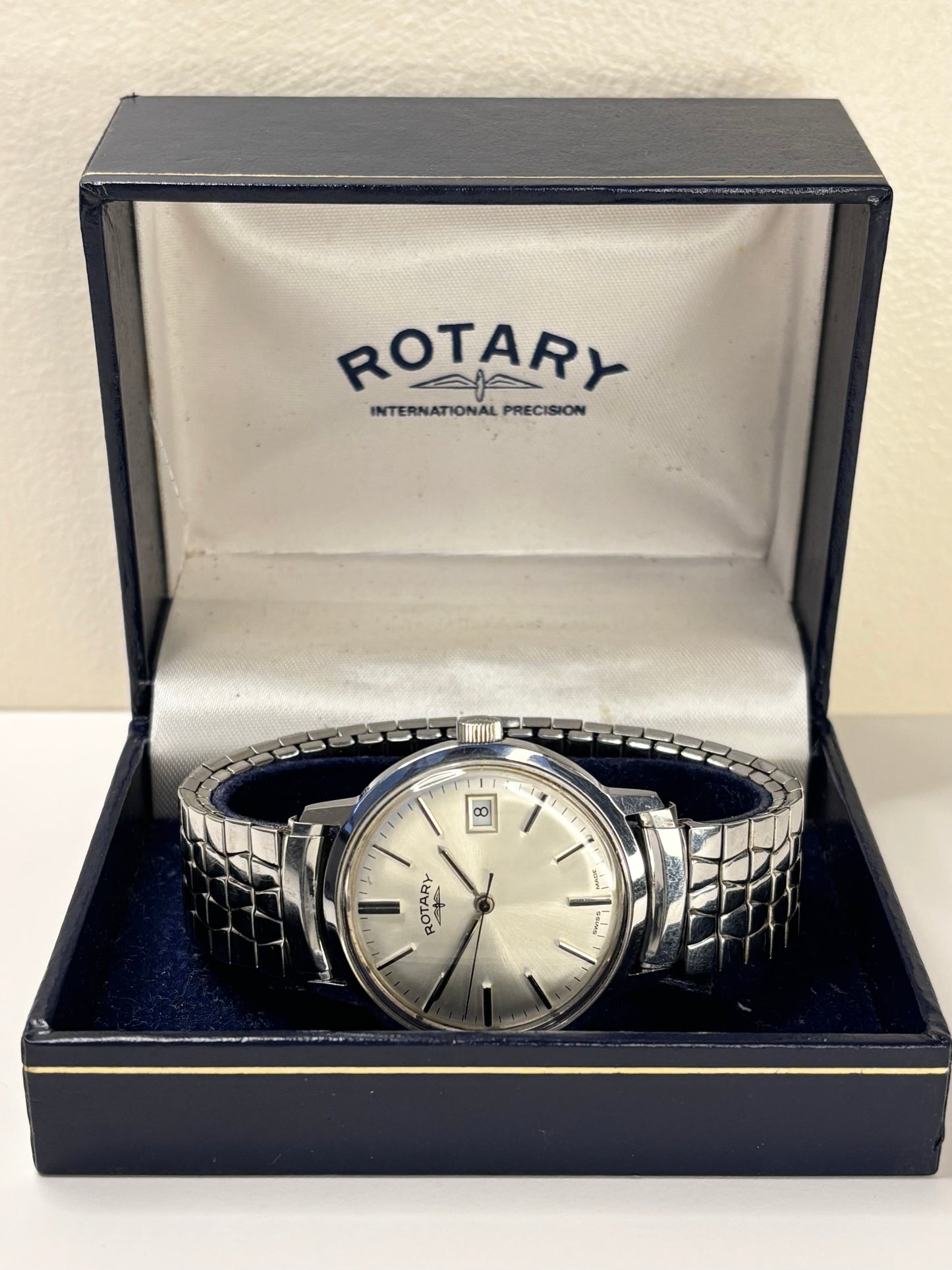 Collectible Rotary 1981 men’s vintage timekeeper featuring white sunburst dial, manual movement and original box