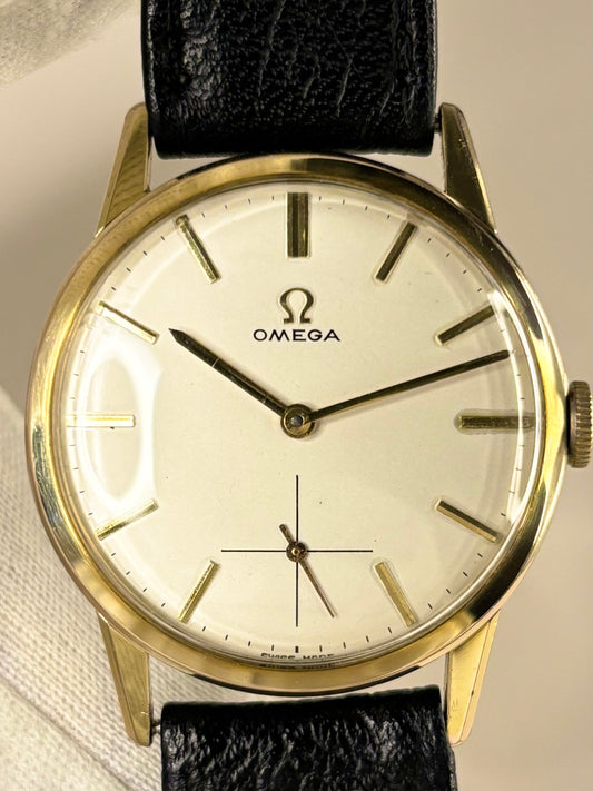 Vintage Omega Ref. 121.001 men’s gold plated dress timekeeper showcasing refined 1960s Swiss design