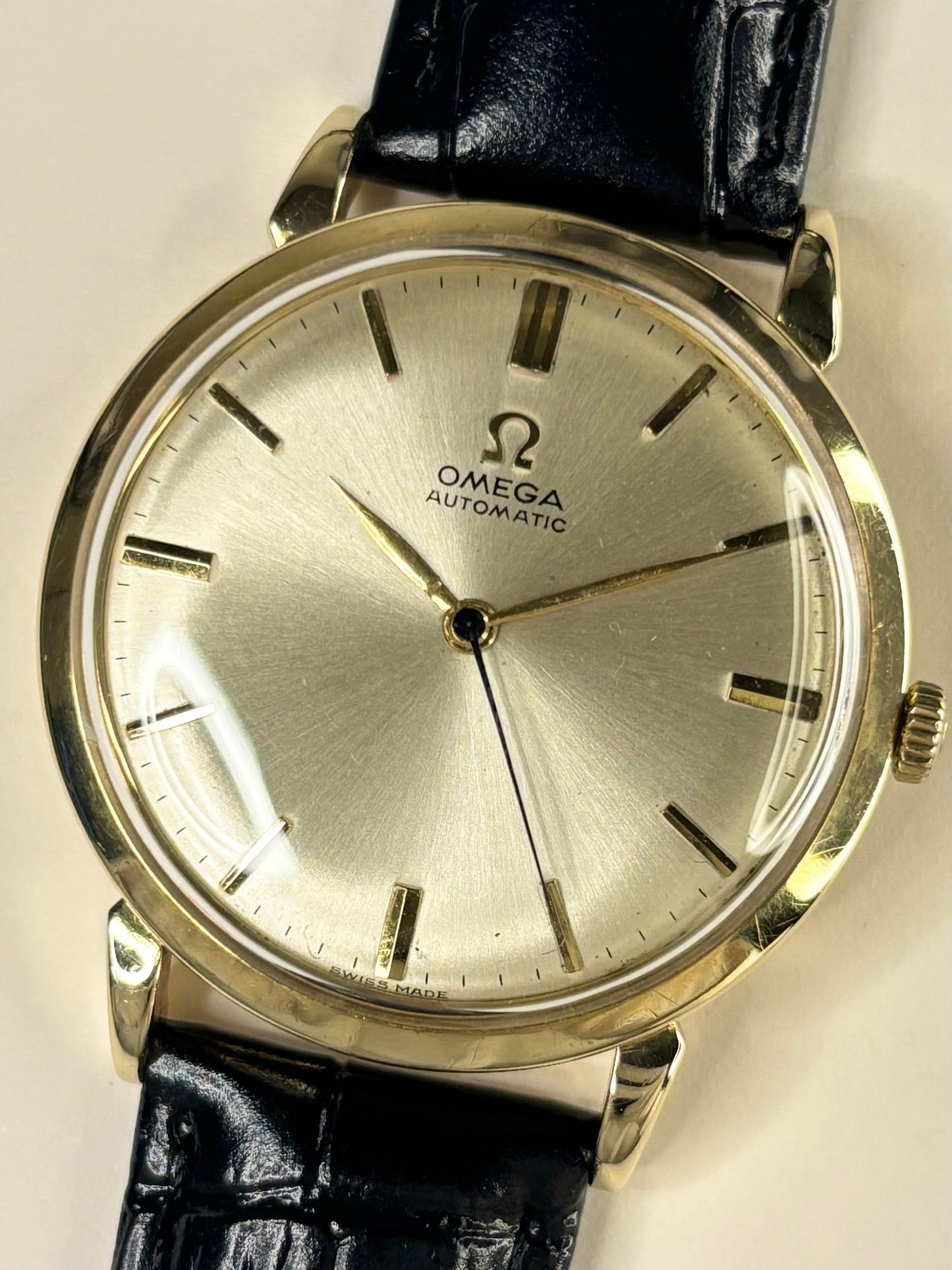 Omega vintage 14ct solid gold men’s watch with automatic movement and white sunburst dial