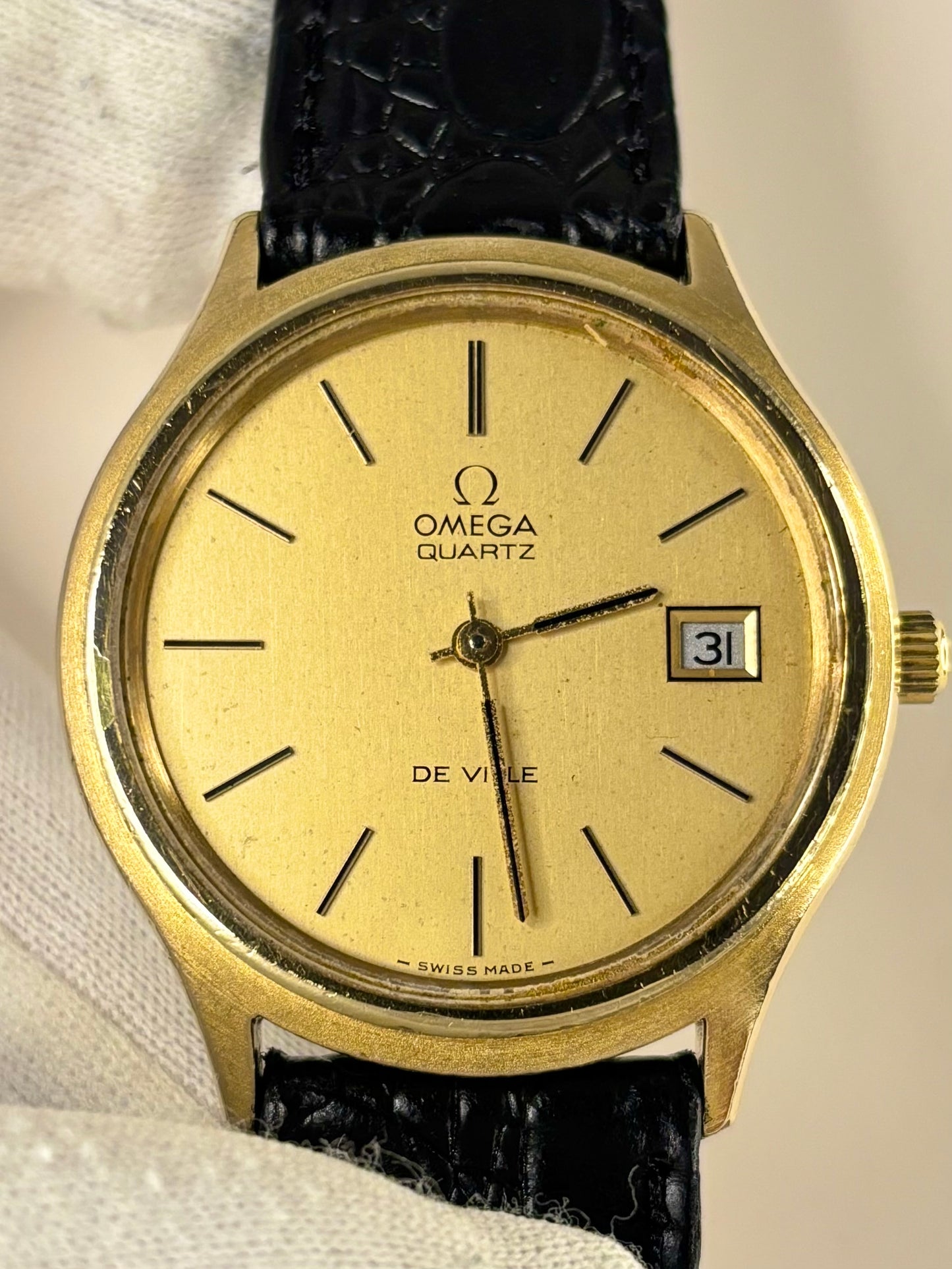 Close up of Omega De Ville 1970s quartz watch gold dial ref. 192.0027