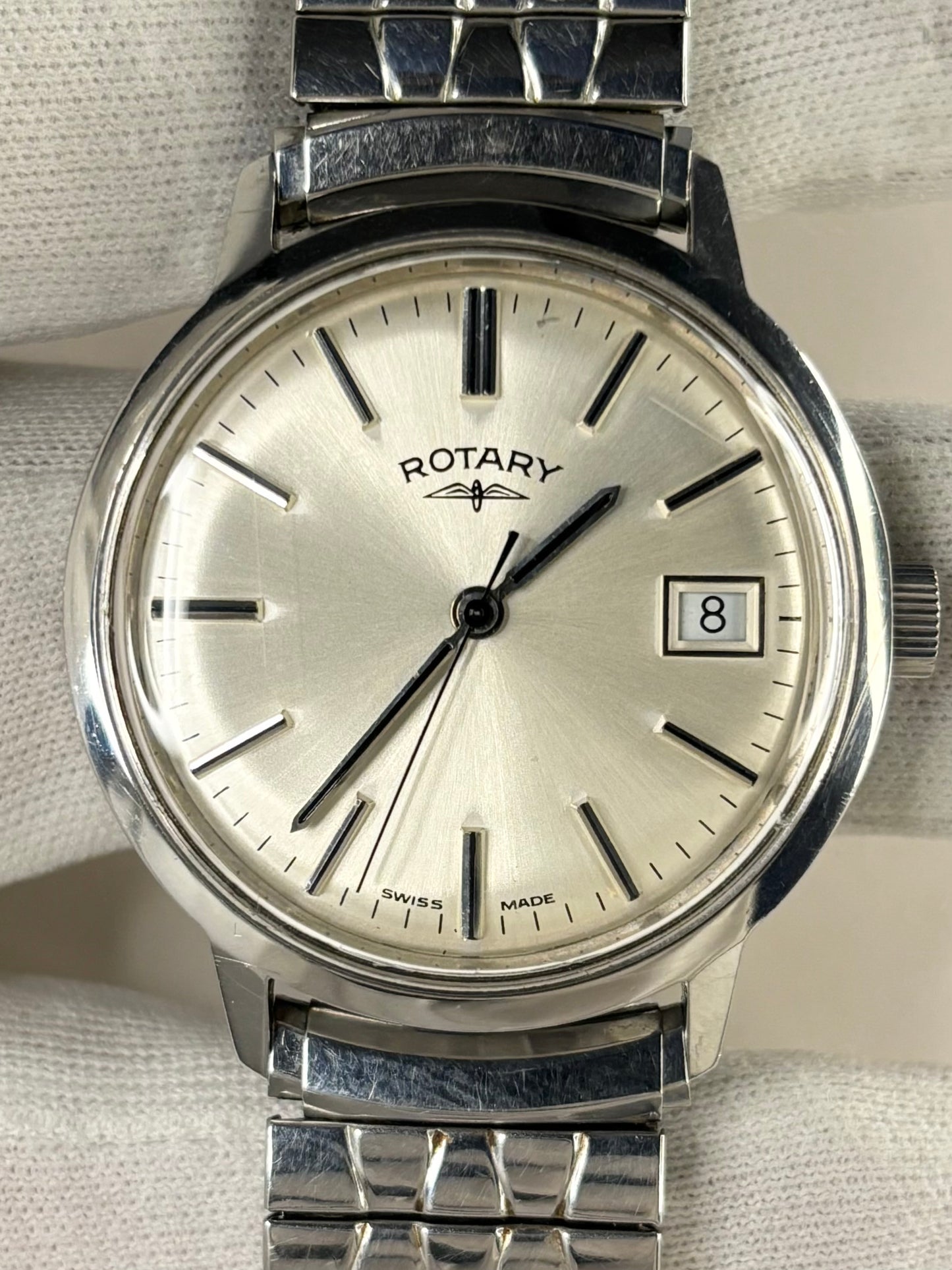 Rotary 1981 men’s dress timekeeper with stainless steel case, white sunburst dial, manual movement and original box and papers