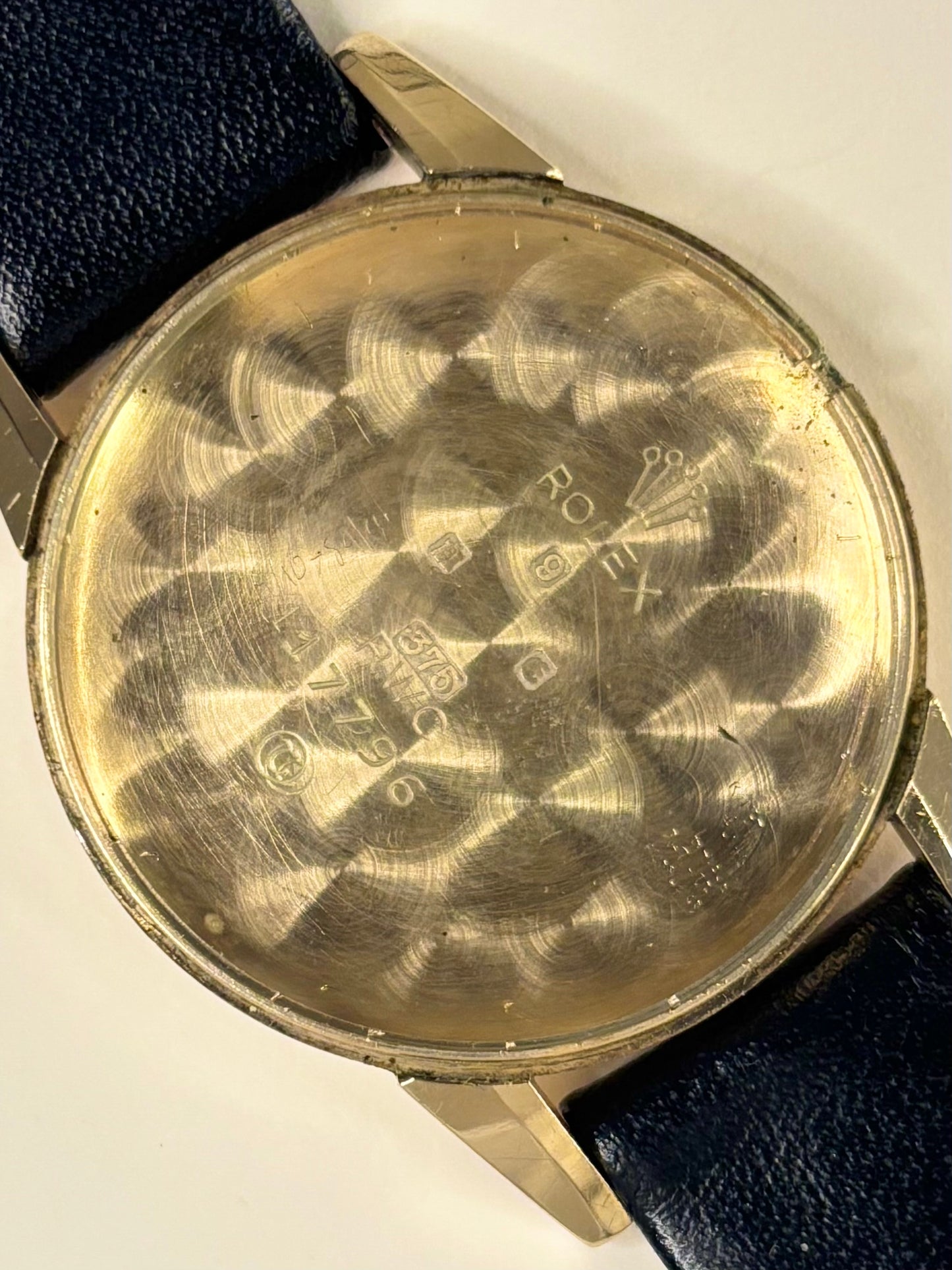 Caseback of Rolex Precision vintage men’s watch ref. 1200 with manual wind movement, 32mm case 9ct gold