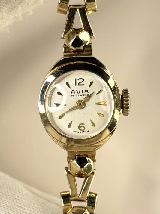 Vintage Avia 1966 ladies solid gold timekeeper showcasing elegant mid-century Swiss design with box