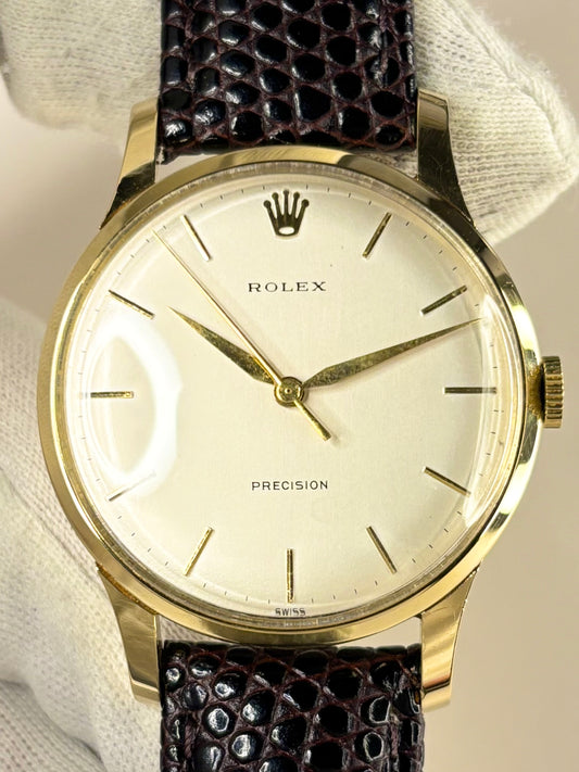 Detailed image of the Rolex Precision dress timepiece showcasing its 18ct solid gold case and crisp dial, presented as a luxury manual timekeeper.