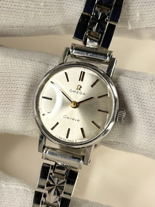 Classic Omega 1960s ladies stainless steel timekeeper showcasing elegant white sunburst dial