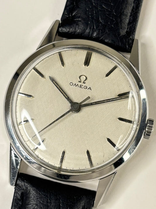 Vintage Omega Ref. 1961 men’s stainless steel dress timekeeper showcasing elegant 1960s Swiss design