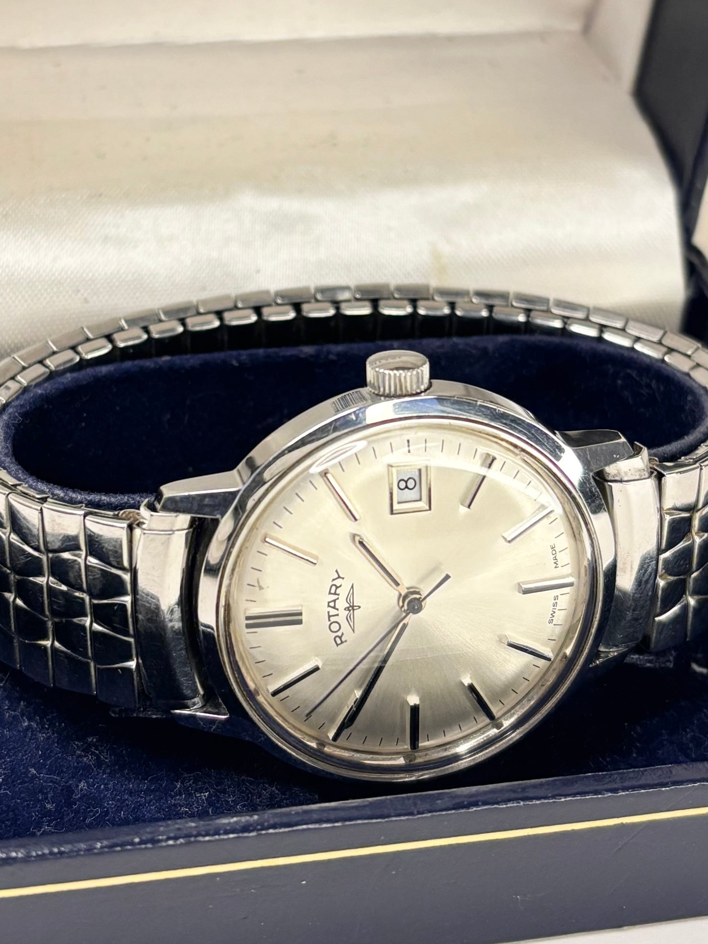 Rotary 1981 men’s dress timekeeper with stainless steel case, white sunburst dial, manual movement and original box and papers