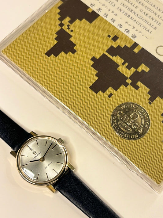 Close-up of Omega ladies vintage watch with sunburst dial and gold-plated case, ref. 511.215