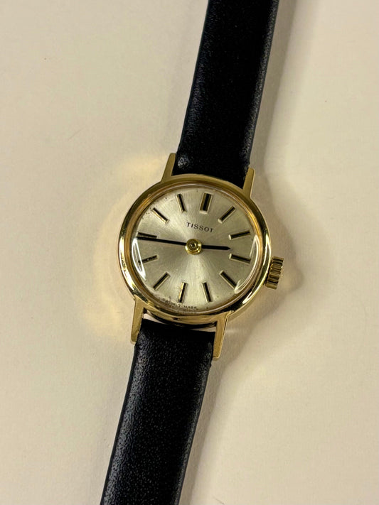 Vintage Tissot Ref. 17073-31 ladies 1957 timekeeper showcasing elegant Swiss design with 18ct gold case