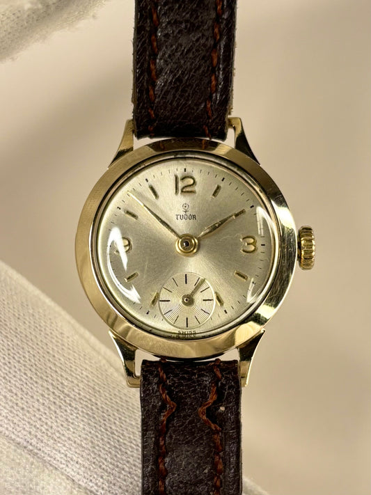 Vintage Tudor 1957 ladies 9ct gold timekeeper showcasing elegant mid-century Swiss design