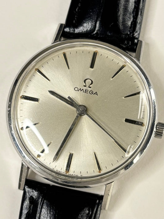 Vintage Omega Ref. 131.018 men’s stainless steel dress timekeeper showcasing elegant 1960s Swiss design