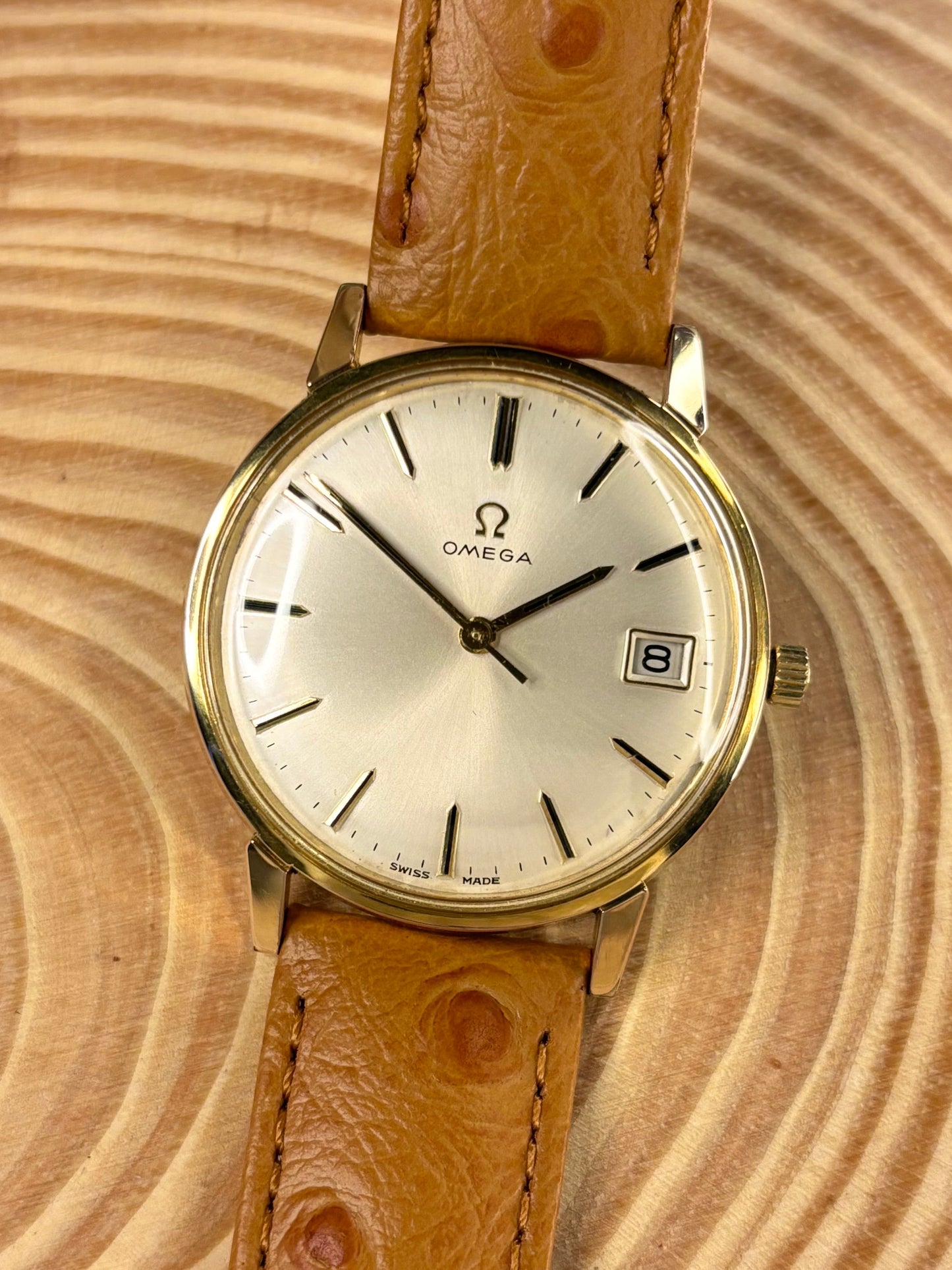 Luxury premium handmade ostrich grain leather strap with soft nubuck lining and refined finish seen on a vintage omega dress watch