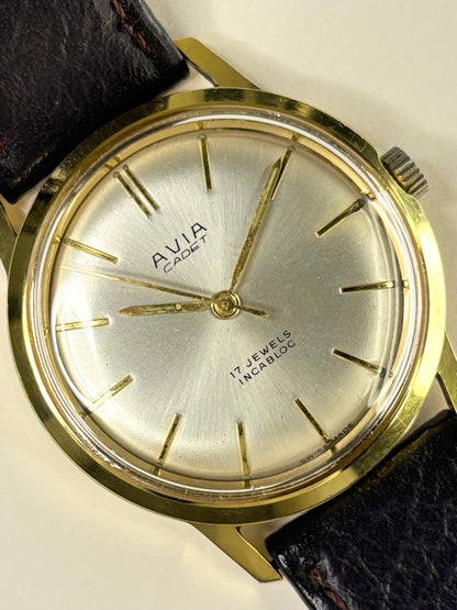 Close-up of Avia Cadet vintage men’s dress watch with gold-plated case and manual movement