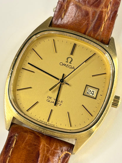 Close up of Omega De Ville 1977 men’s quartz watch gold dial vintage style