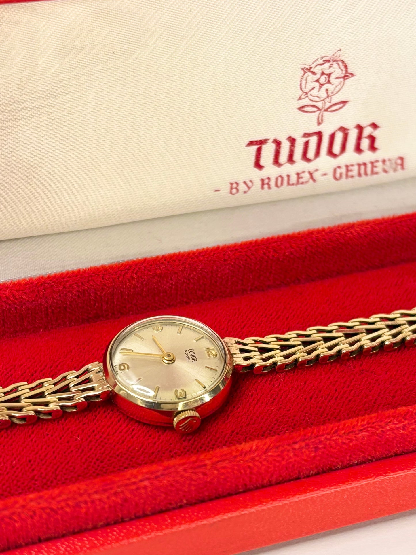 Detailed shot of the Tudor ladies manual-wind timepiece highlighting its crisp sunburst dial and gold case as a reliable vintage timekeeper.