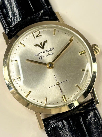 Close up of Longines Wittnauer 1960s manual watch white sunburst dial gold case