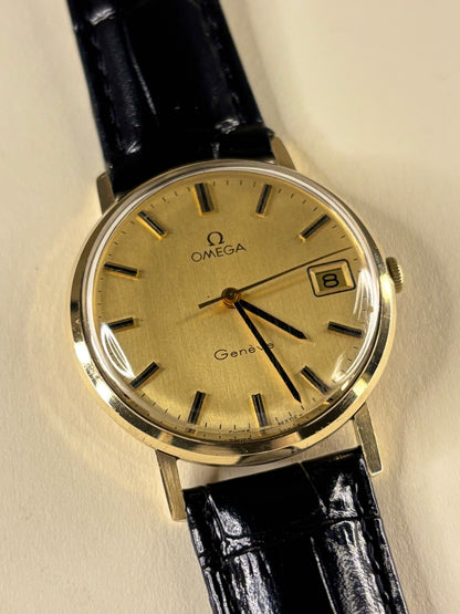 Collectible Omega Genève Ref. 132.8413 timekeeper featuring gold case and classic dial styling