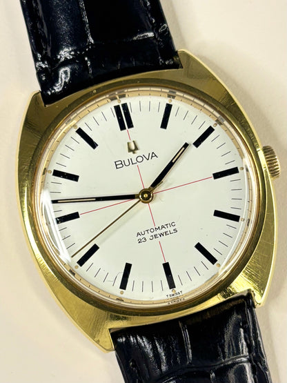 Close-up of Bulova 1970s men’s gold-plated dress watch white dial