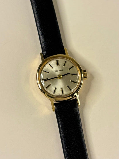 Collectible Tissot Ref. 17073-31 1957 ladies vintage timekeeper featuring white sunburst dial and Swiss craftsmanship