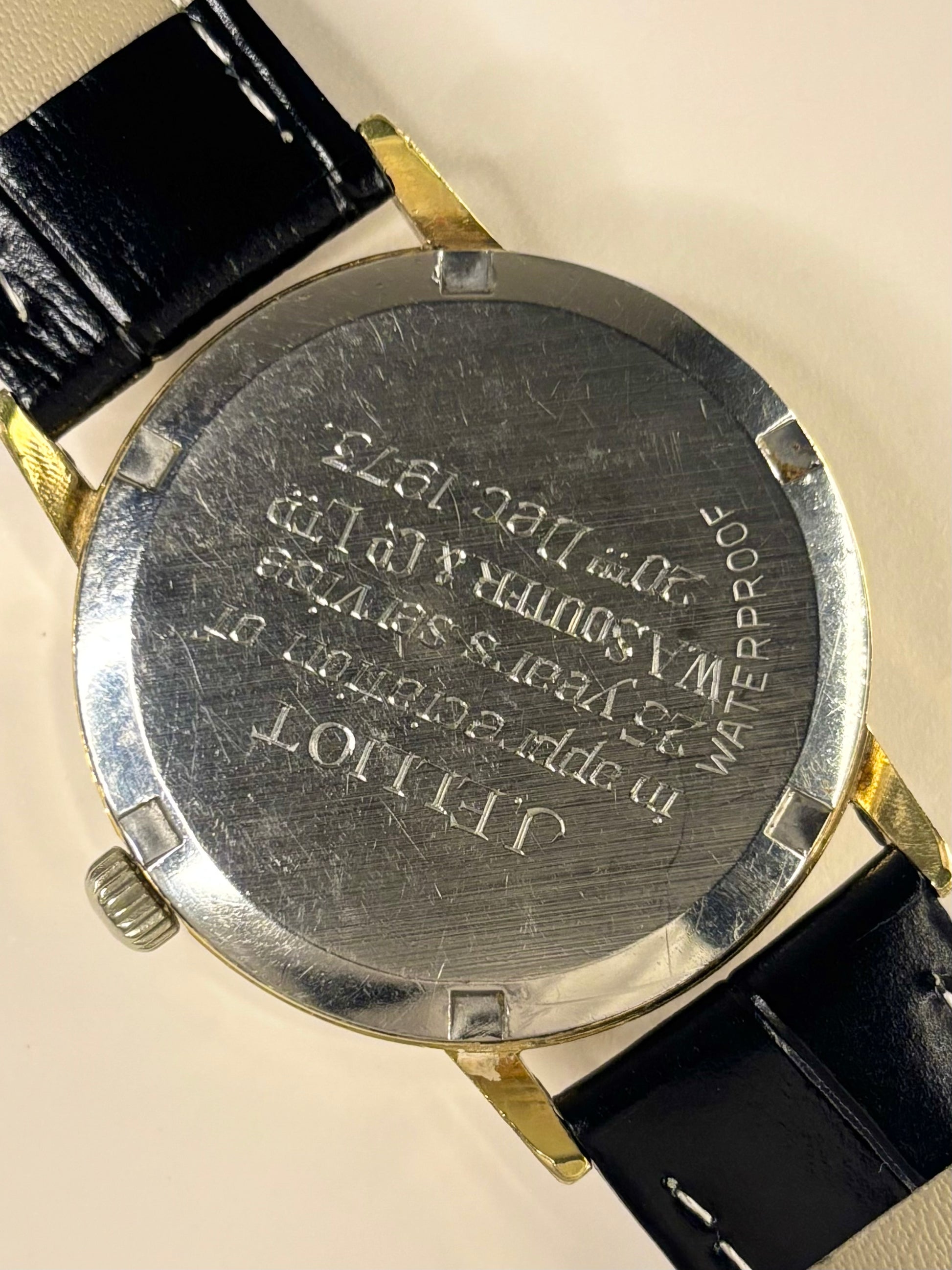 Caseback of Omega Genève vintage men’s watch ref. 135.070 with manual wind movement cal. 601