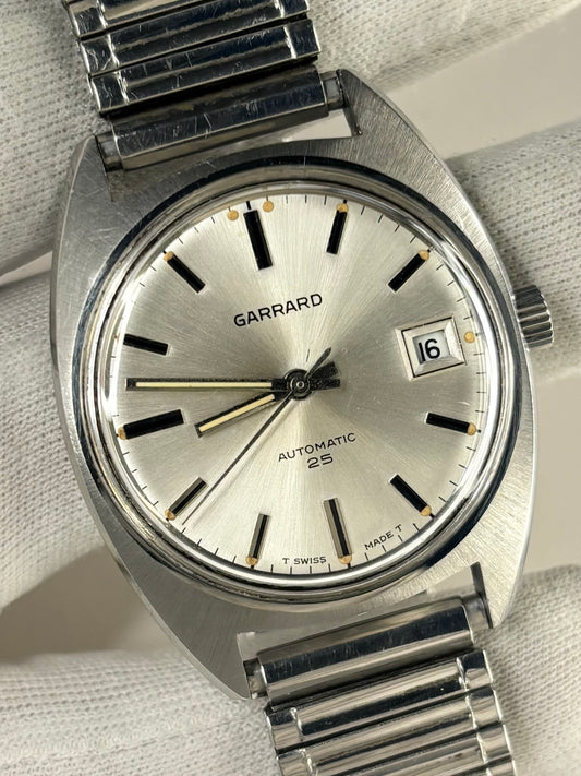 Vintage c.1976 Garrard automatic timepiece – men's stainless steel dress watch with white sunburst dial, in good condition with age-appropriate marks