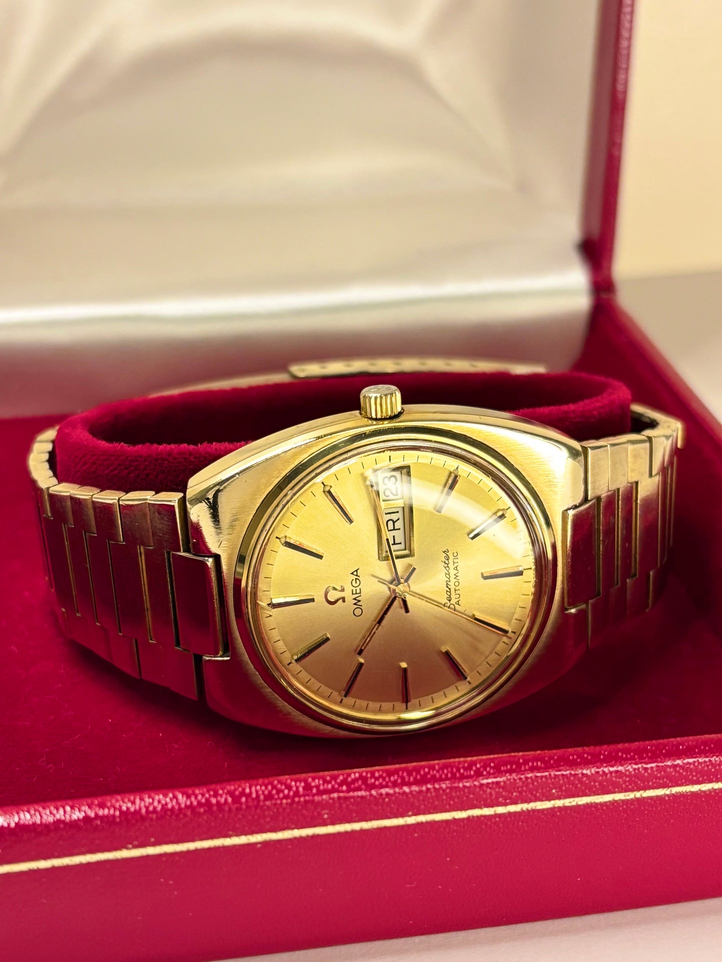 1970s Omega Seamaster automatic watch ref. 166.0216 with gold-toned dial and gold-plated case, a classic Swiss vintage timepiece and refined mechanical timekeeper