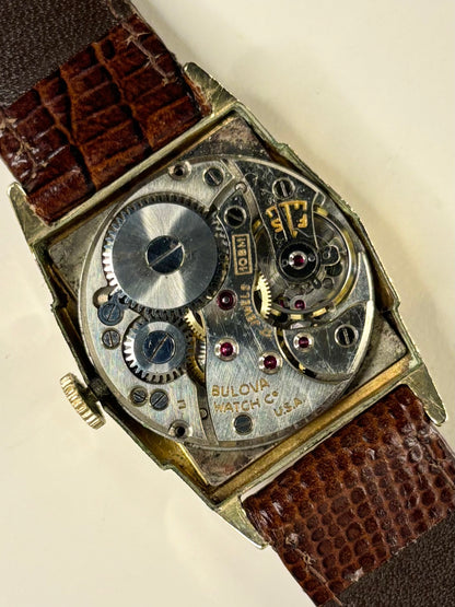 Vintage 1953 Bulova dress timepiece ref. 10BM — 26mm rolled gold case, manual wind timekeeper with crown and mechanism detail