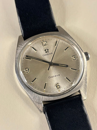 Collectible Omega Genève Ref. 135.041 1969 men’s dress timekeeper featuring white sunburst dial and vintage charm