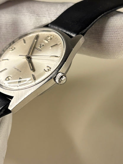 Side profile of Omega Genève Ref. 135.041 men’s vintage dress timekeeper with slim 1969 stainless steel case styling omega signed crown