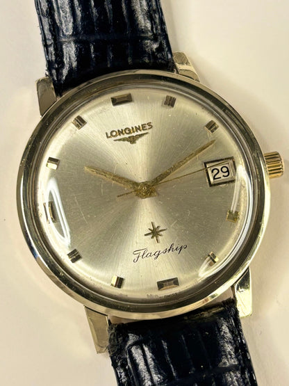 Close up of Longines Flagship 1966 vintage men’s watch sunburst dial gold case