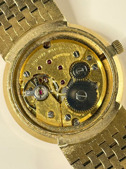 Vintage Bulova dress timepiece ref. 1974 — 34mm gold-plated case with gold dial, manual wind movement and polished caseback