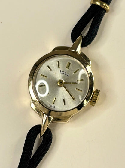 Vintage Tudor 1957 ladies 9ct gold timekeeper showcasing elegant mid-century Swiss design
