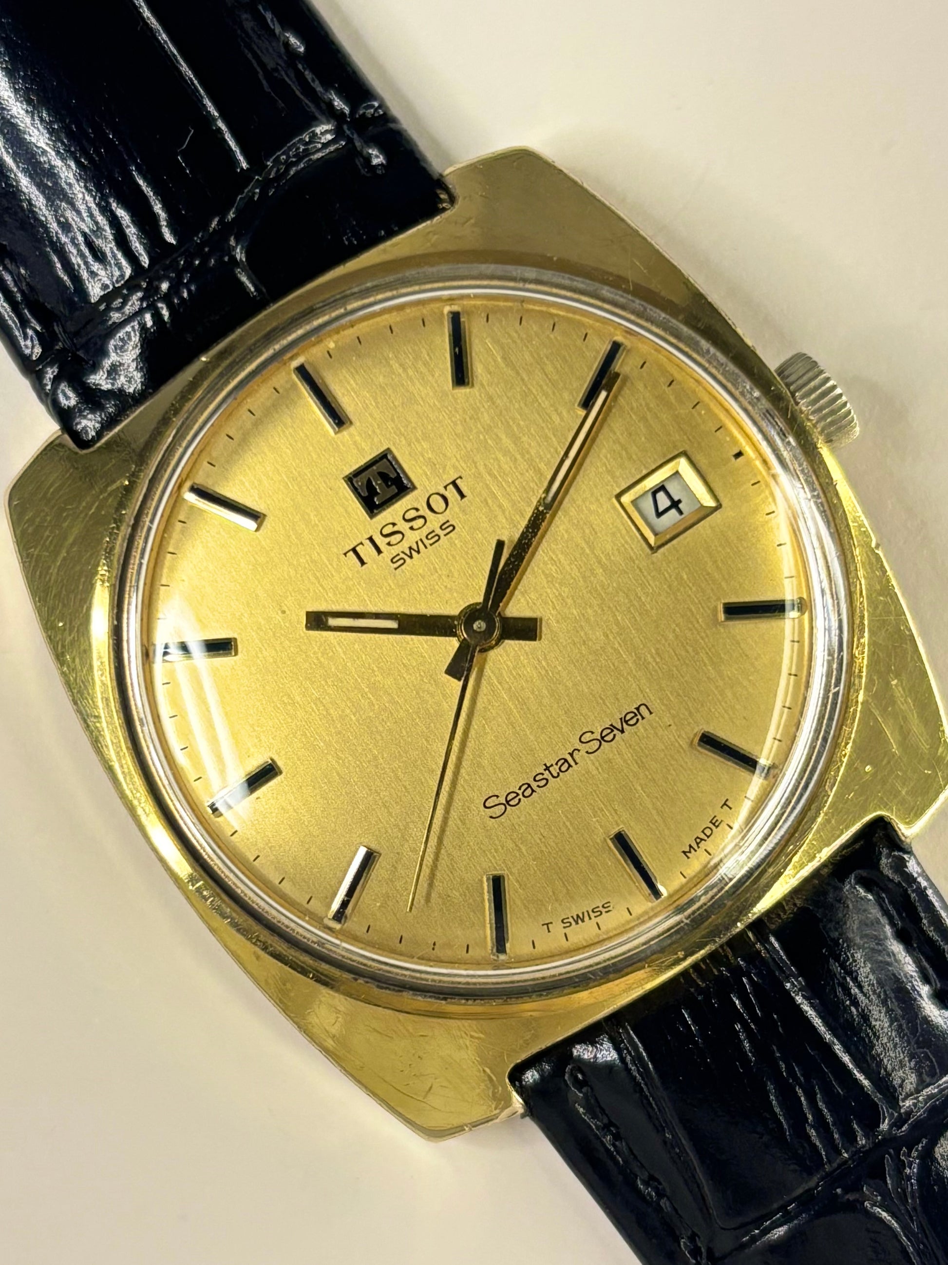 Vintage Tissot Seastar Seven timepiece and reliable timekeeper with gold-toned dial and gold-plated case, manual movement