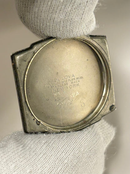 1953 Bulova manual wind dress watch ref. 10BM — rolled gold 26mm case, original bracelet and caseback design with box included