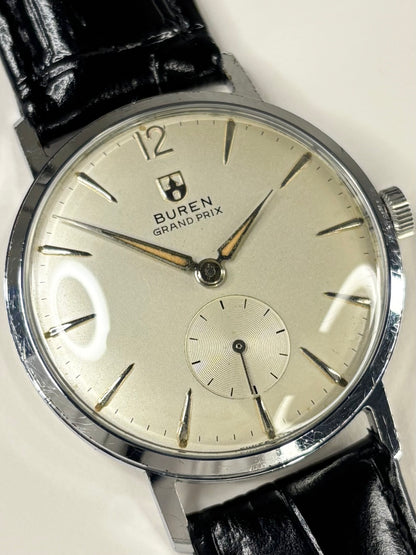 Close up of Buren Grand Prix 1959 men’s watch stainless steel case
