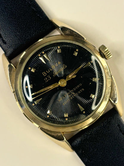 Vintage Bulova watch – c.1955 men's gold-plated automatic dress watch with black textured dial, in good condition with minor age-appropriate marks.