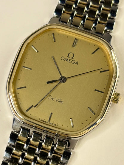 Close up of Omega De Ville 1982 men’s quartz watch gold dial elegant design