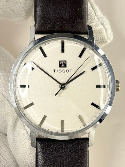 1960s Tissot vintage dress watch with stainless steel case and classic dial, a timeless Swiss manual timepiece and refined mechanical timekeeper.