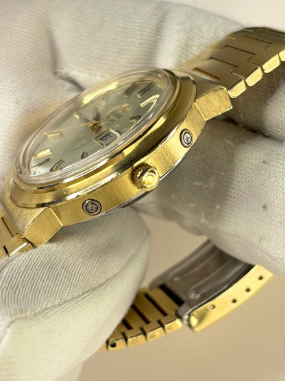 Side profile of Omega Ref. 196.0058 1973 men’s vintage dress timekeeper with slim gold plated case styling omega signed crown