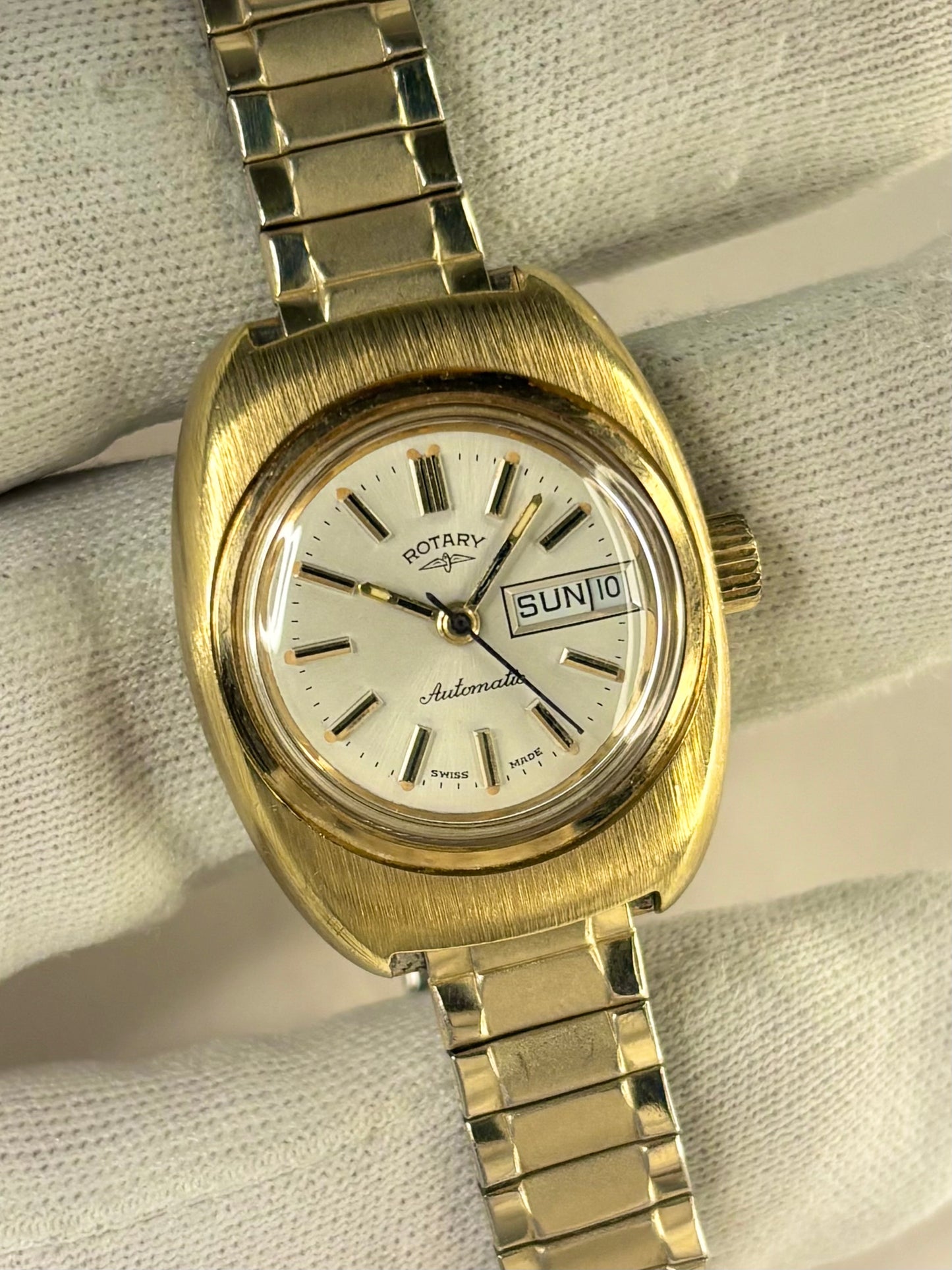 Vintage c.1977 Rotary automatic timepiece – ladies' gold-plated dress watch with white sunburst dial, in good condition with only minor age-appropriate marks