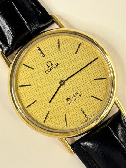 Premium luxury vintage Omega De Ville dress timepiece from the 1970s, featuring a gold-toned dial and gold-plated case, model 191.0092 with calibre 1351 quartz movement, a refined handmade mens timekeeper.
