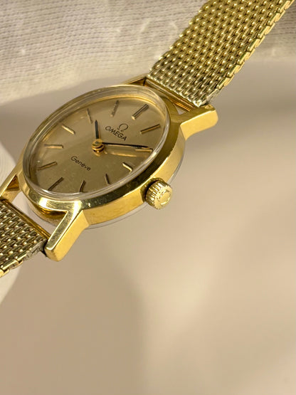 Side profile of Omega Genève ladies Ref. 511.0411 timekeeper with slim gold plated 1972 case styling omega signed crown 